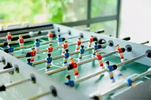 A fun foosball table available for indoor entertainment and games.